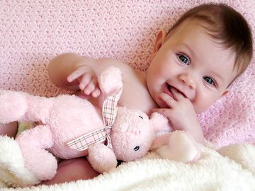 baby girl with toy bunny rabbit.