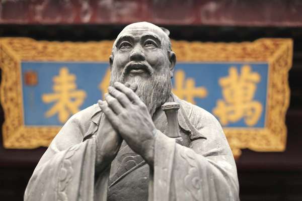 Confucius statue at a Confucian Temple in Shanghai, China. Confucianism religion