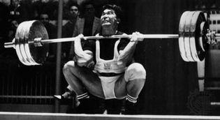 Tommy Kono on his way to winning the silver medal in the middleweight weightlifting competition at the 1960 Olympics in Rome.