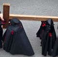 Holy week. Easter. Valladolid. Procession of Nazarenos carry a cross during the Semana Santa (Holy week before Easter) in Valladolid, Spain. Good Friday